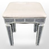 A contemporary mirrored stool, height 46 cm.