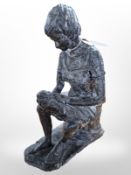 A painted pottery sculpture of mother and child,