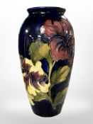 A Moorcroft amaryllis limited edition vase, No. 38 of 200, height 25 cm.