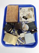 A leather box of antique keys, compacts, costume jewellery,