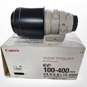 A Canon EF 100-400mm F/4.5-5.6 L IS USM lens, with lens case and hood, boxed.
