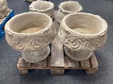 A pair of concrete circular garden planters, height 38cm.