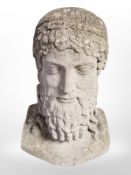 A concrete bust of a Greek philosopher,