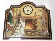 A reproduction battery wall clock depicting a dog seated by a fire,