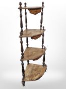 A Victorian rosewood and satinwood inlaid corner whatnot, height 128 cm.