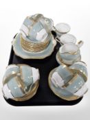 Thirty nine pieces of Aynsley tea china on turquoise ground,