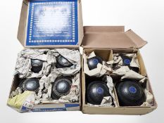 A boxed set of four Henselite lawn bowls, size 5 and 1/8,