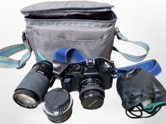 A Miranda SLR camera, with Miranda 50mm lens, a further 70-210mm macro lens and a Hanimex 1:2.