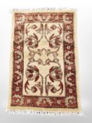 A rug of Zeigler design, 94 cm x 61 cm.