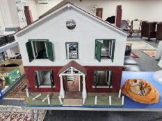 A large early 20th century double sided doll's house,