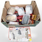 A quantity of Meccano components, manuals, etc.