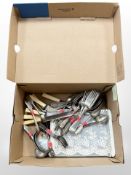 A quantity of EPNS stained steel cutlery and an Avon lace gift set.