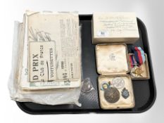 A group of motor show journals, together with racing club medals, sporting medallions,