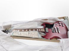 A Gibson SG 70s tribute electric guitar.