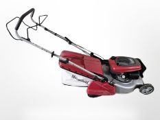 A Mountfield petrol lawnmower with Honda engine.