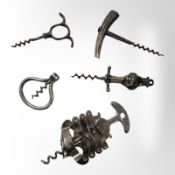A zigzag corkscrew, a further lacquered brass corkscrew depicting a monkey,