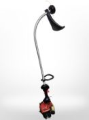 A petrol grass strimmer.