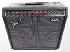 A Fender Eighty-Five amplifier, with lead.