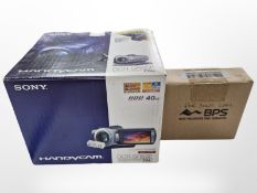 A Sony Handycam DCR/SR55E, boxed with accessories, charger, etc.