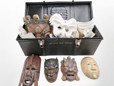 A box of decorative Venetian masks in carved wood, papier-mâché, etc.