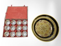 A boxed set of twelve Chinese cups and a French Quimper bowl.