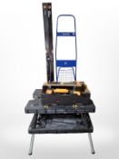 A two tier workbench, two 1200mm spirit levels, an IKEA sack barrow, further tools, drill bit set,