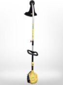 A Stanley petrol grass strimmer.