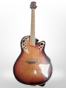 An electro-acoustic guitar.