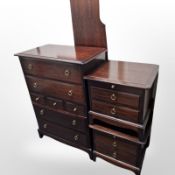 A Stag seven drawer chest, a pair of three drawer bedside chests and 4ft6 headboard.