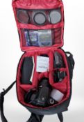 A Canon 400D digital camera, with Canon zoom lens EF-S 18-55mm, in camera bag with instructions,