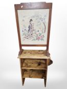 A rustic pine low shelf and an oak tapestry fire screen