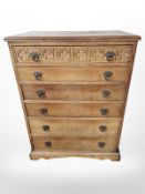 A reproduction carved oak six drawer chest, 79 cm x 48 cm x 104 cm.