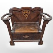 An Edwardian oak hall seat/umbrella stand,