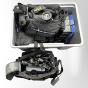 A crate containing a quantity of cameras and video recording equipment,