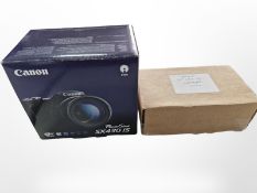 A Canon Powershot SX430 IS digital camera with HD 20mp lens, boxed with instructions, charger, etc.