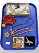 A group of costume jewellery to include jade pendant on cord chain, necklace with earrings,