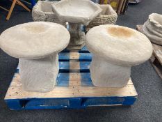 A pair of concrete staddle stones, height 43cm.