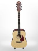 A Fender Squier SD-3NAT acoustic guitar, with a guitar stand.