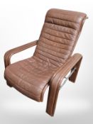 A 20th century Danish chrome and stitched brown leather armchair, width 77 cm.