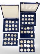 Three cases containing a quantity of coins which include 1898 USA silver dollar,
