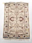 An Afghan/Caucasian rug, 93 cm x 62 cm.