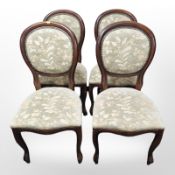 A set of four reproduction floral upholstered dining chairs