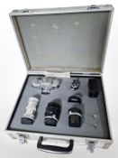 An aluminium camera case containing Soviet Kiev camera, numbered 7506242, 4/135 lens,