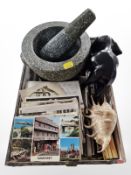 A granite pestle and mortar, sea shell, vintage Tom & Jerry pencils, postcards,