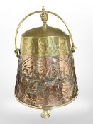 A 19th century Dutch polished copper and brass coal bin,