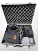 An aluminium camera case containing Sigma 10-20mm lens, Canon EF-S 18-55mm lens,