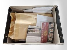 Two boxes of assorted Royal Mail mint stamps,