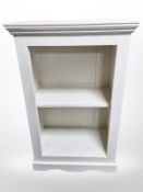 A painted open bookcase,