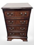 A reproduction mahogany four drawer chest, 46 cm x 38 cm x 73 cm.