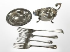 A silver sauce boat, Birmingham 1936, together with four silver forks and a silver coaster.